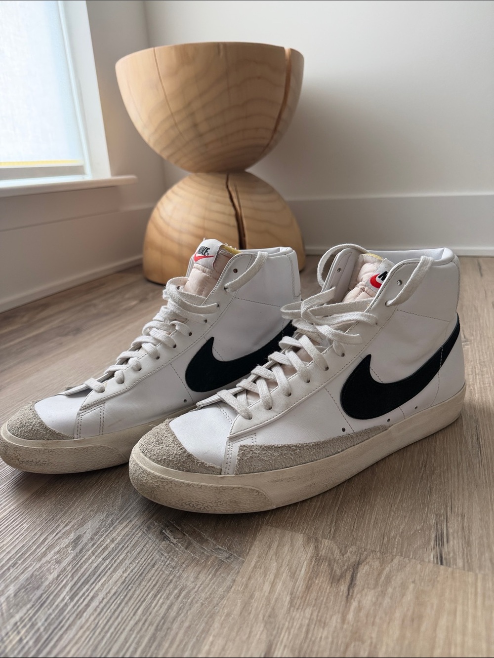 Nike White High-Top Sneakers with Black Swoosh